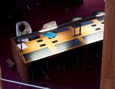 Students studying at a library desk