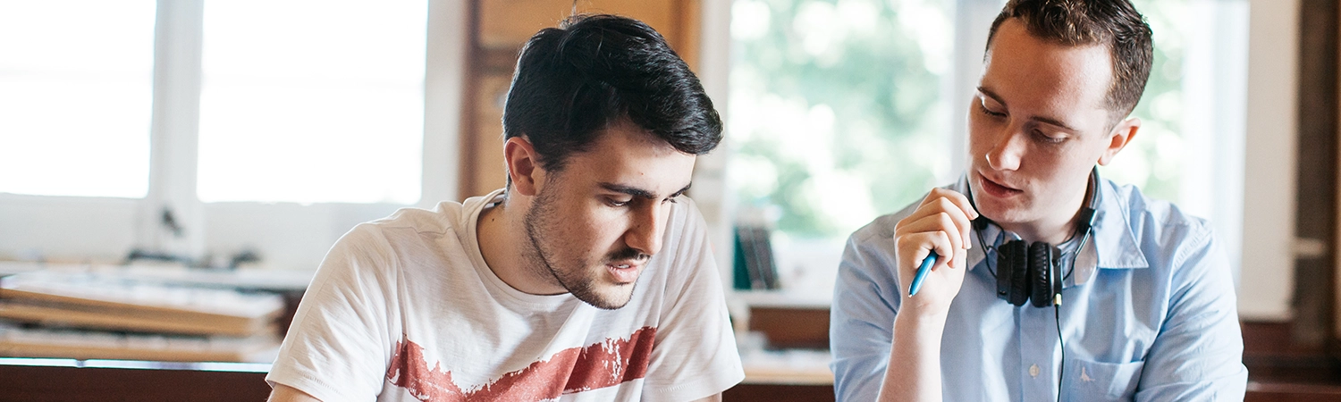Two students studying at a desk