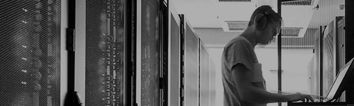 Man typing in server room