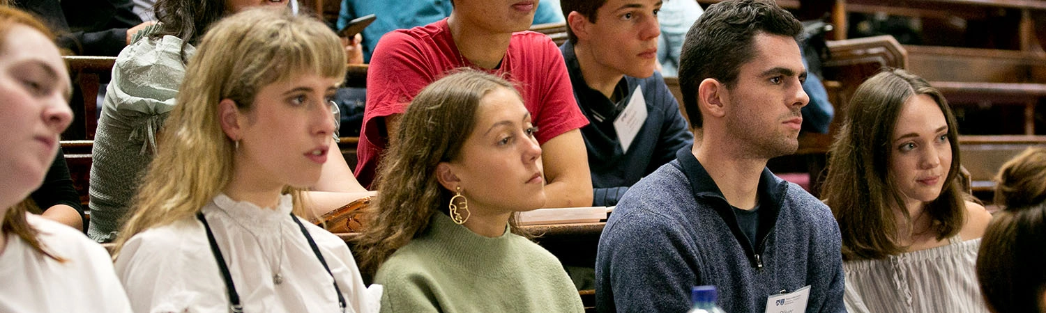 university students listen attentively to the interesting guest lecturer