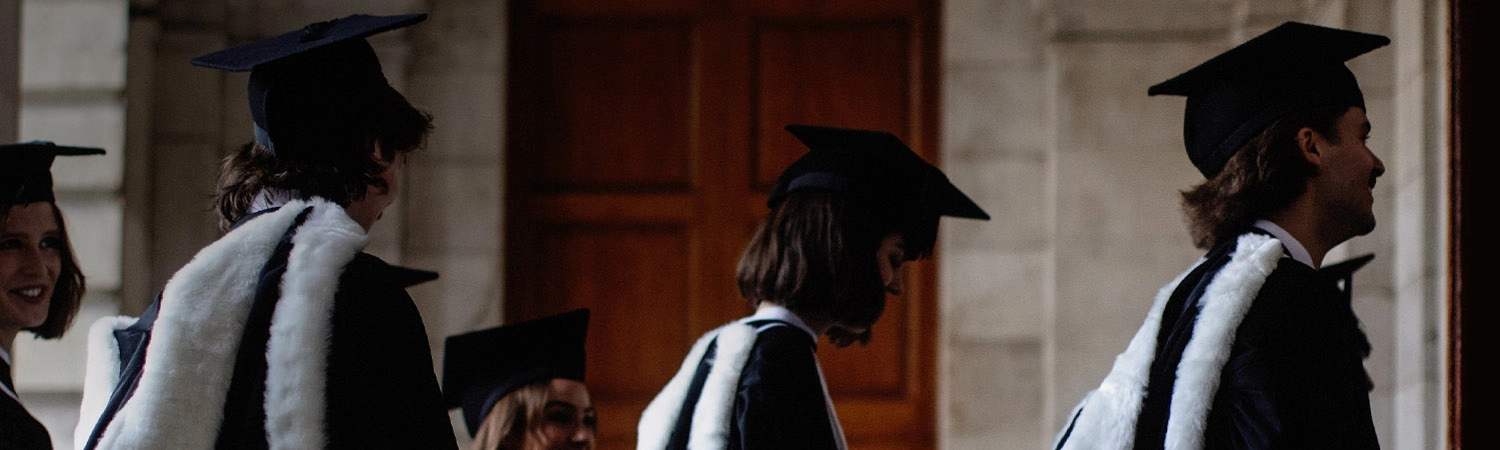 Two students in cap and gowns