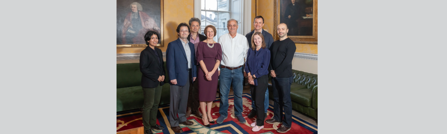 A group of people at a board meeting reception
