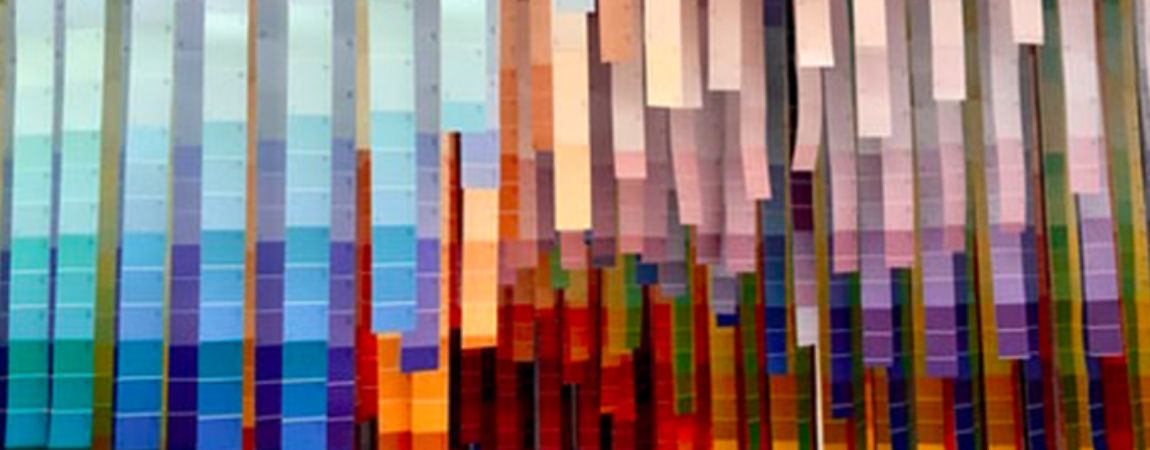 An image of coloured ribbons hanging from a ceiling