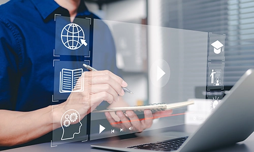 Student interacting with a digital screen showing a webinar and a video playing to represent digital learning