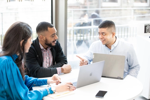 Full-time MBA students working on a group project