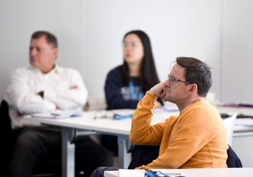 Three employee participants in an education programme at Business TCD