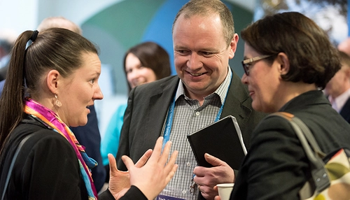 Three people in discussion