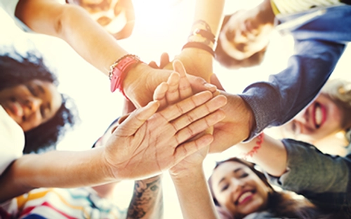 Circle of hands clasped together