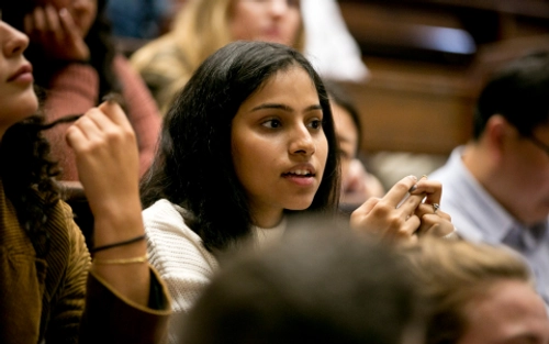 student in a busy lecture hall