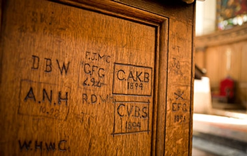 Etchings on wood in a lecture hall