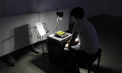 Student at work in dark room