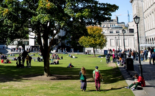 Students walking on the grass on Trinity campus