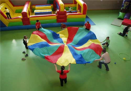 Family holding a colourful flag