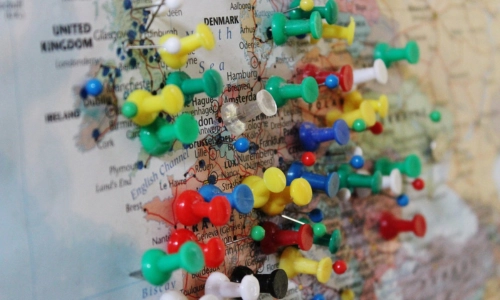 A map of Europe covered in pins.