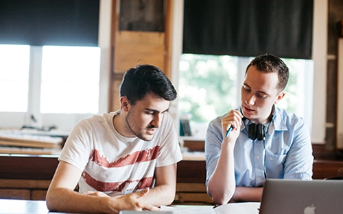 Two male students studying at desk