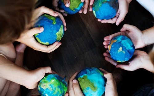 Children holding globes