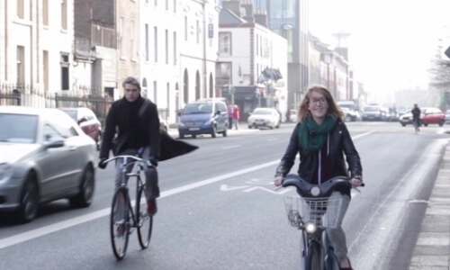 Video still of people cycling through Dublin