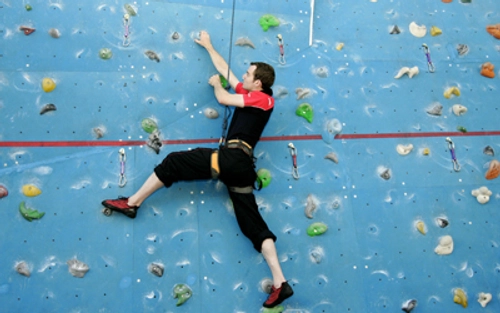 A person using the climbing wall