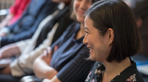 A student seated in a Literary Translation class.