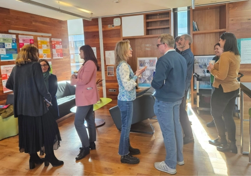 School colleagues in conversation in Trinity Long Room Hub.