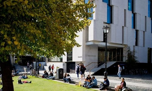 People seated in front of the Long Room Hub.