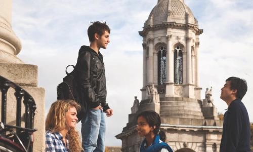 Students in conversation in front of Trinity's Campanile.