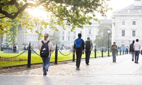 Students walking down a path to Front Square.