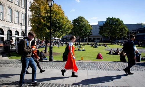 Students walking alongside Fellow's Square.