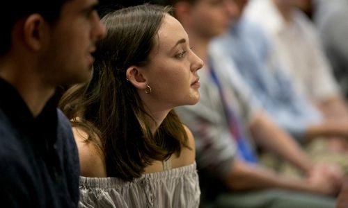 A student paying attention in a lecture.