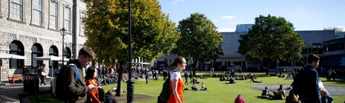 Students walking by Fellow's Square and the Old Library.