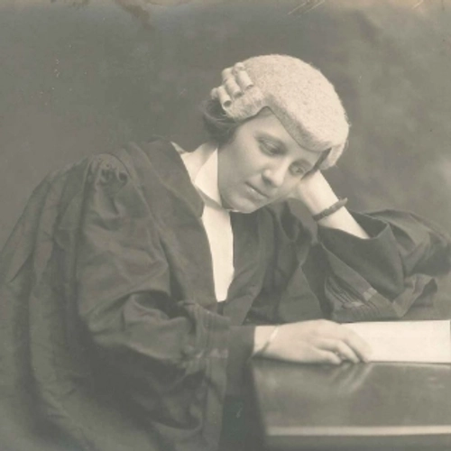 Frances Kyle reading a law document