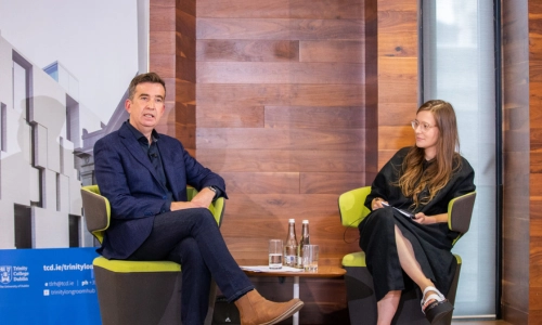 Two speakers seated at the democracy forum event