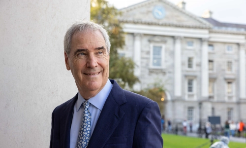Michael Ignatieff standing in front of a Trinity College Dublin building