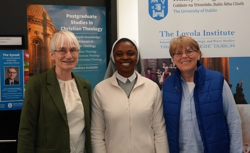 One scholarship attendee and two Loyola personnel