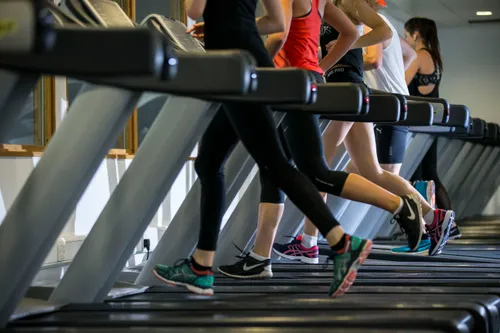 Image of three women running on threadmills