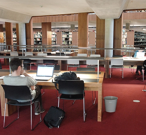 Student studying at desk in the Berkeley Library