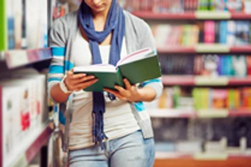 girl reading in library