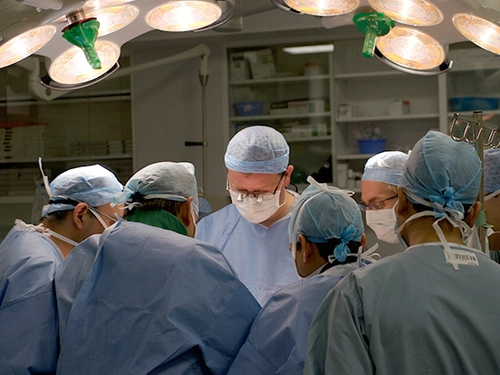 Surgeons in operating theatre.