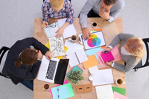 4 people sitting at a table