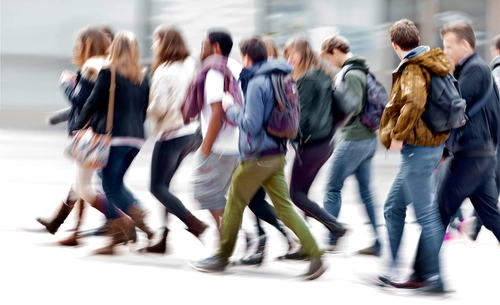 Students walking across the TCD campus