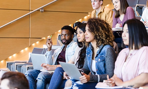 university students listen attentively to the interesting guest lecturer