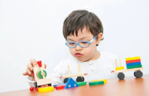 A child playing with colourful blocks