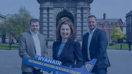 Three people from industry and academia holding a Ryanair sign to mark a new collaboration