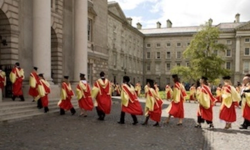 Graduates gathering entering the exam hall building graduation ceremony