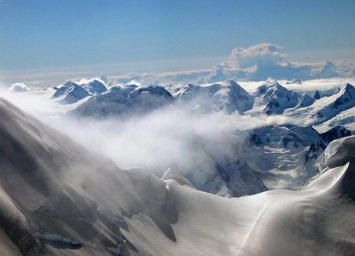 Image of mountain peaks and cloud.