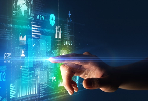 A finger touching a glass touch screen computer