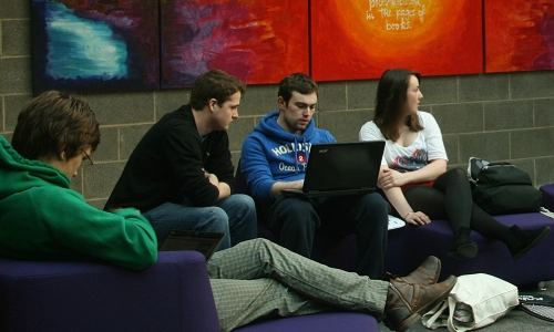 3 students in a Library