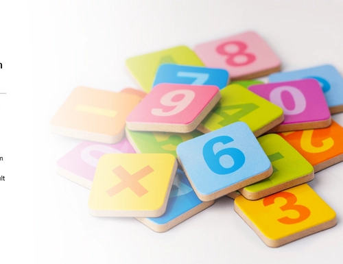 A pile of tiles with letters and numbers written on them