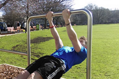 Man doing a pullup on a fitness trial