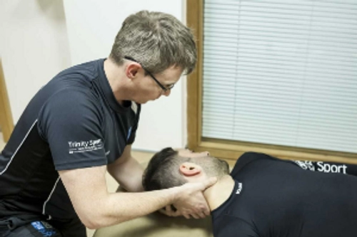 Sports masseur working on a client